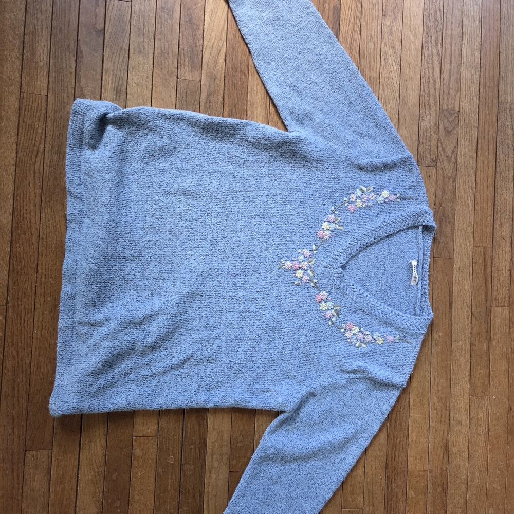 Elegant Blue V-Neck Sweater with Floral Accents